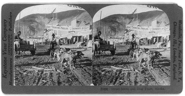 Photo of Stereograph,Street Scene,Dog Team,Alaska,Shops,Gold Town,c1926
