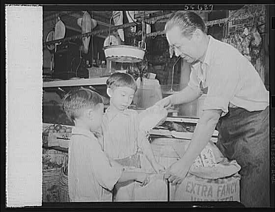 Photo:1950s Grocery Store Man with Two Boys Extra Fancy Display