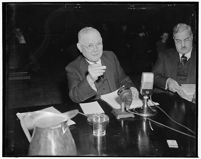 Photo:Wm Green 1939 1940 man speaking at microphone table press photo