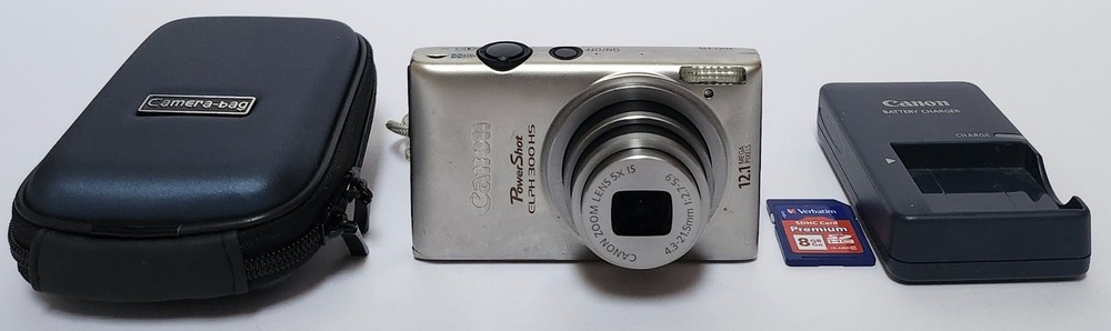 Canon PowerShot ELPH 300 HS 12.1MP Digital Camera Silver Tested Mark on Screen
