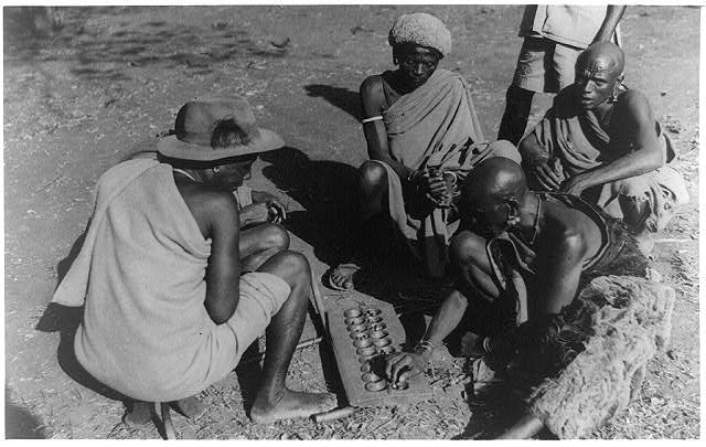 Photo:African men playing board game stones, Kenya 1940's