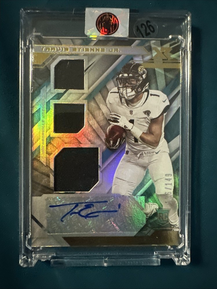 2021 Panini XR Travis Etienne Rookie Triple Swatch Auto #212/149