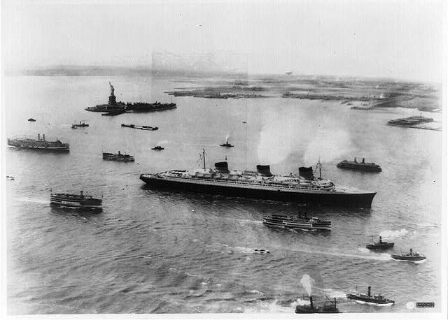 S.S. Normandie arriving in New York Harbor on maiden voyage,Statue of Liberty