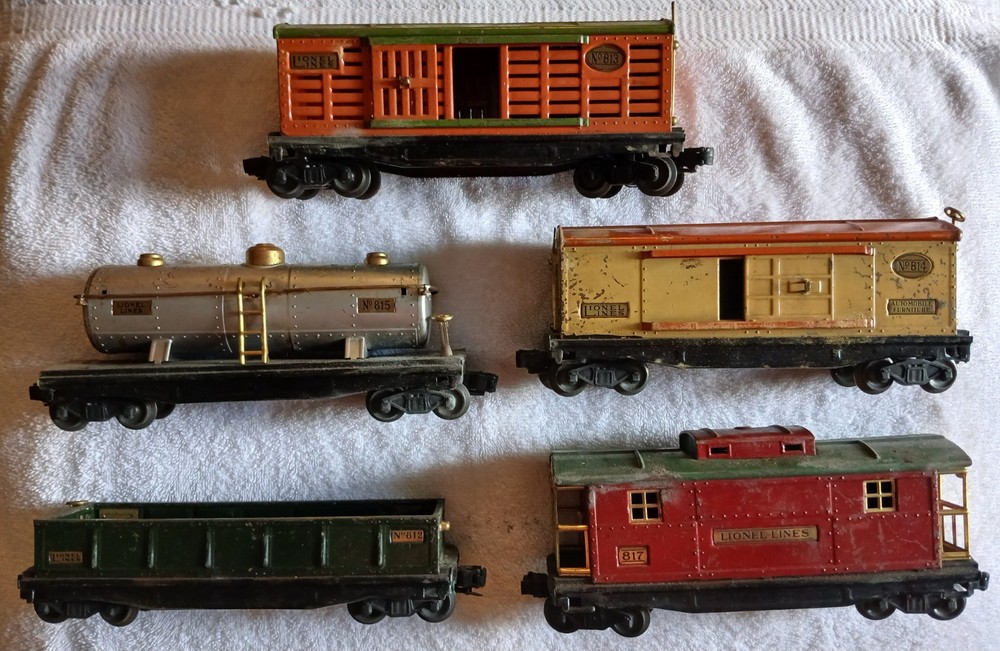 5 lionel prewar freight cars with postwar trucks put on