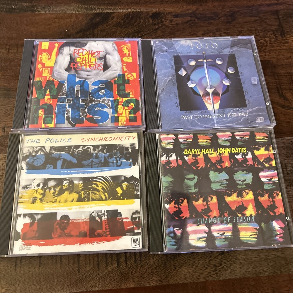 Vintage Lot Of 4 CDs: Red Hot Chili Peppers, Toto, The Police, And Hall And Oats