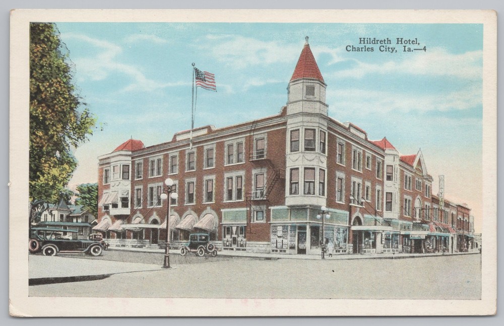 Hildreth Hotel~Busy Corner View~American Flag~Charles City IA~Vintage Postcard