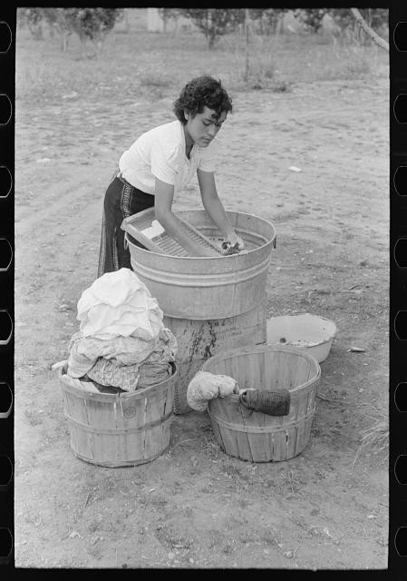 Photo:Daughter of Spanish-American farmer washing, Chamisal, New Mexico