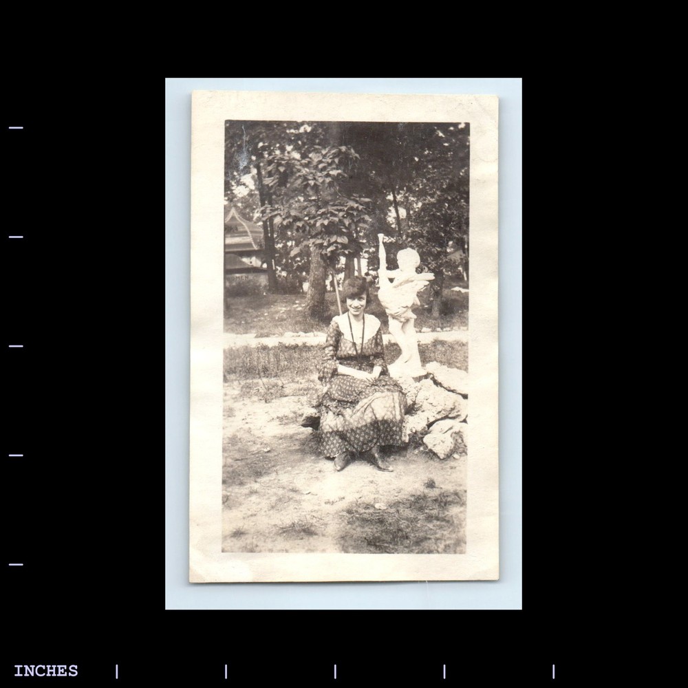 Old Vintage Photo WOMAN SITTING IN YARD BY STATUE