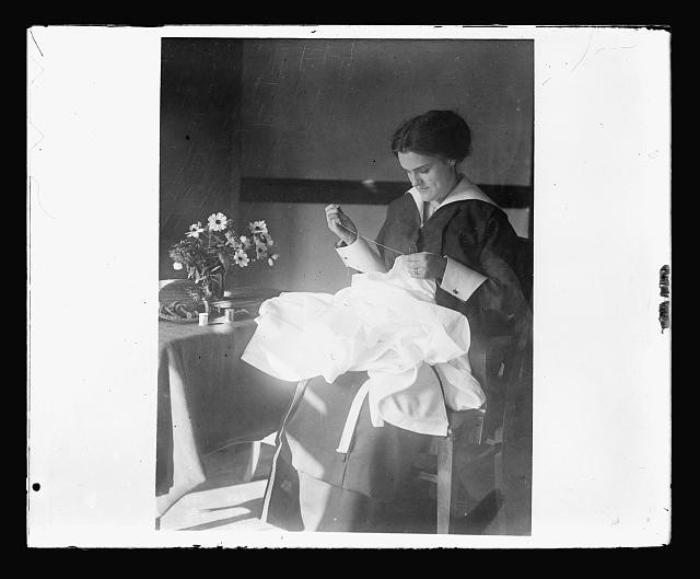 Photo:1920s Woman Sewing at Table Flowers Interior Portrait