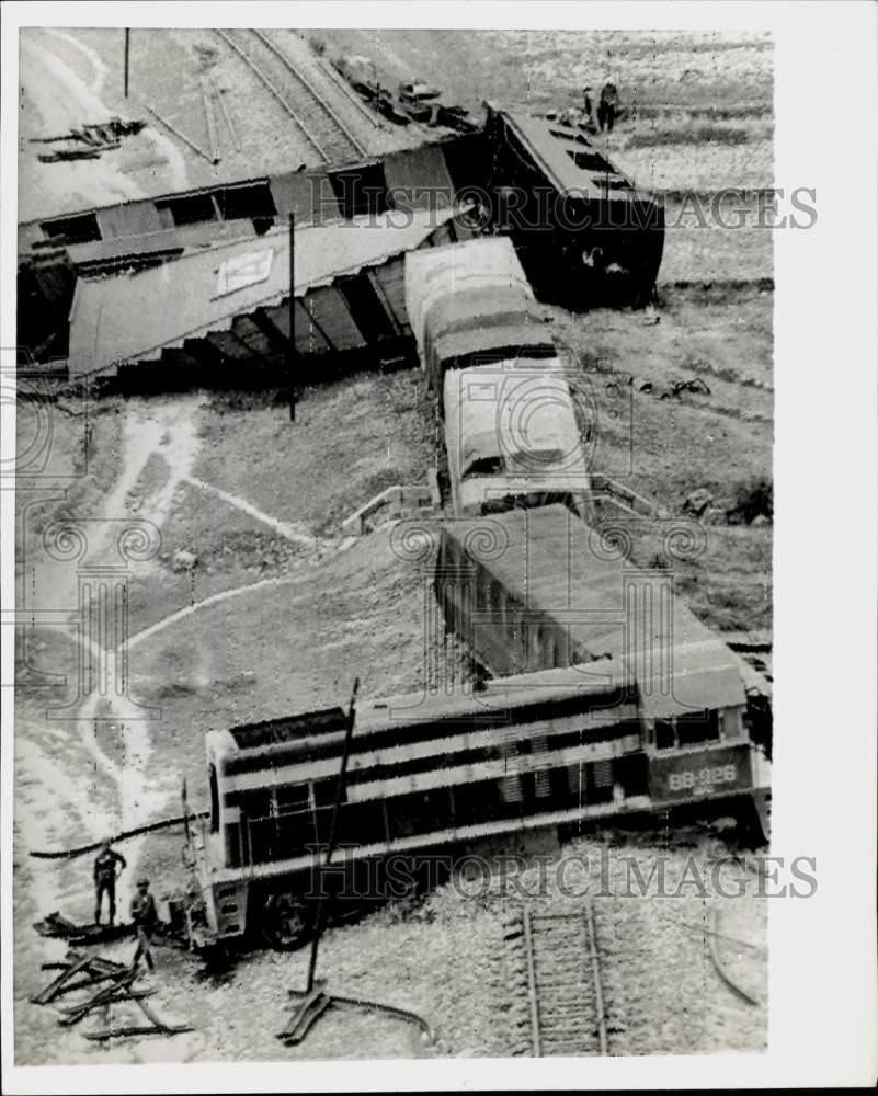 1965 Press Photo Derailed passenger train cars just north of Saigon, Vietnam.