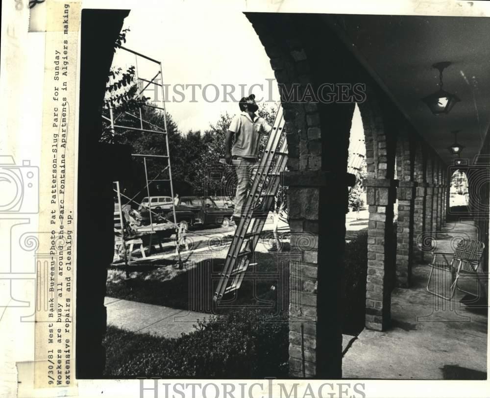 1981 Press Photo Workers make repairs, Parc Fontaine Apartments in Algiers