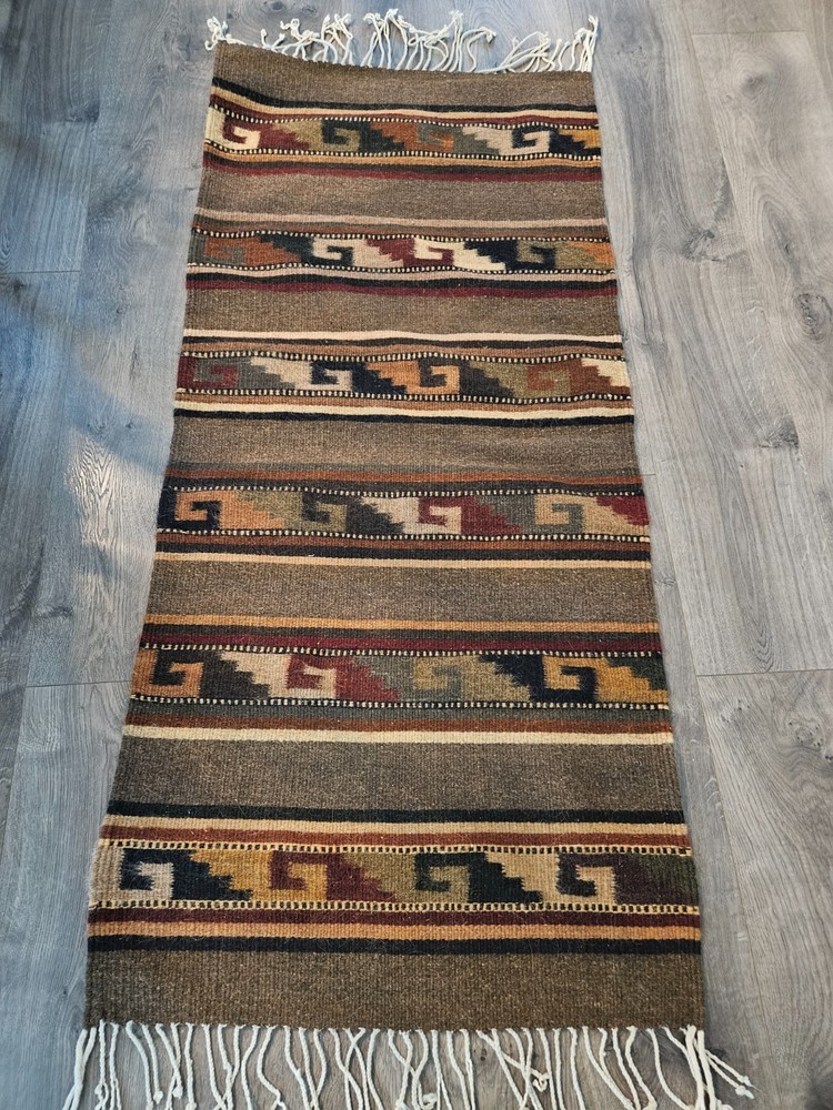 HANDMADE WOOL RUG. 23X51 Made by the women of Vida Nueva. Pattern on both sides