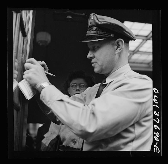 Photo:Chicago Illinois Bus Driver Punching Tickets 1943 Streetcar Transit