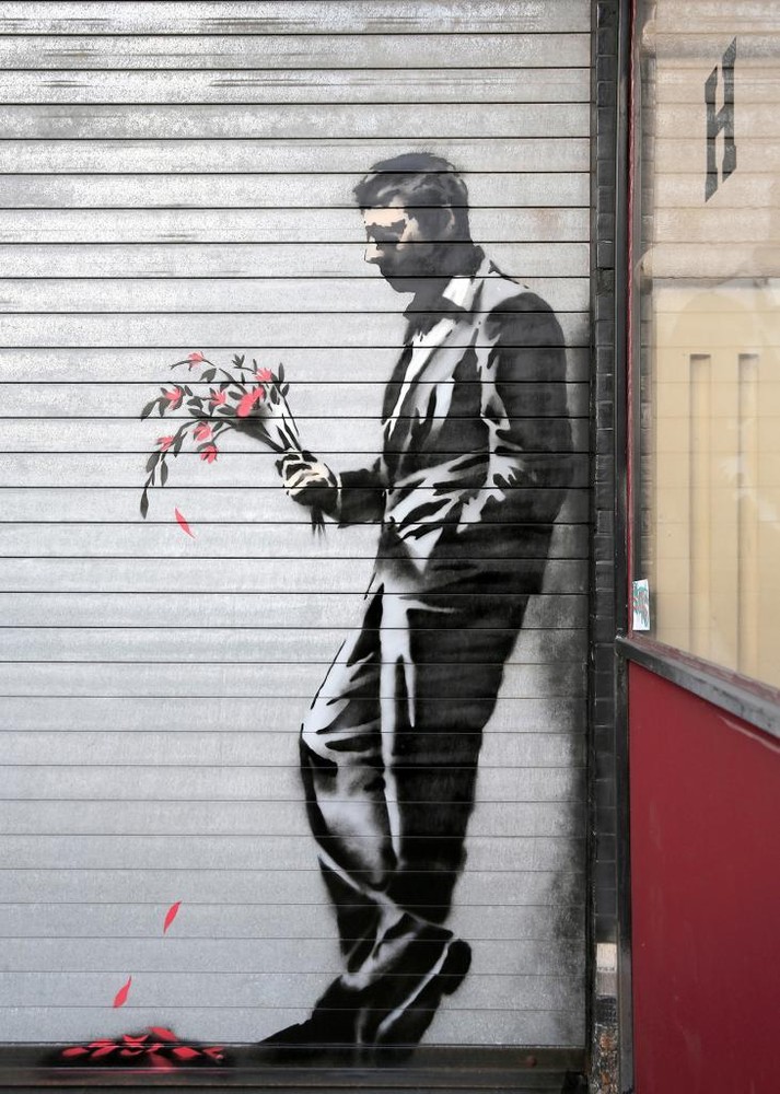 BANKSY STREET ART *FRAMED* CANVAS PRINT Sad Man with flowers 18x12