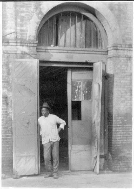 Photo:New Orleans La African American Man Doorway 1920s Brick Building