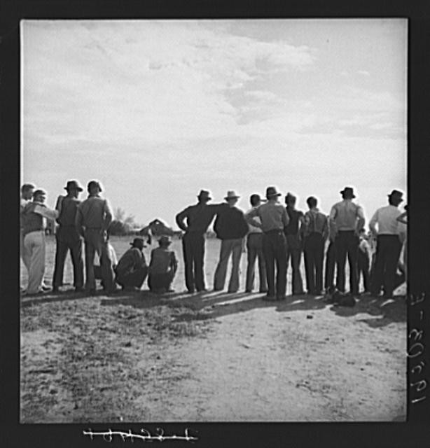 Photo:Shafter California Kern County 1938 Migrant Camp Ball Game Watchers