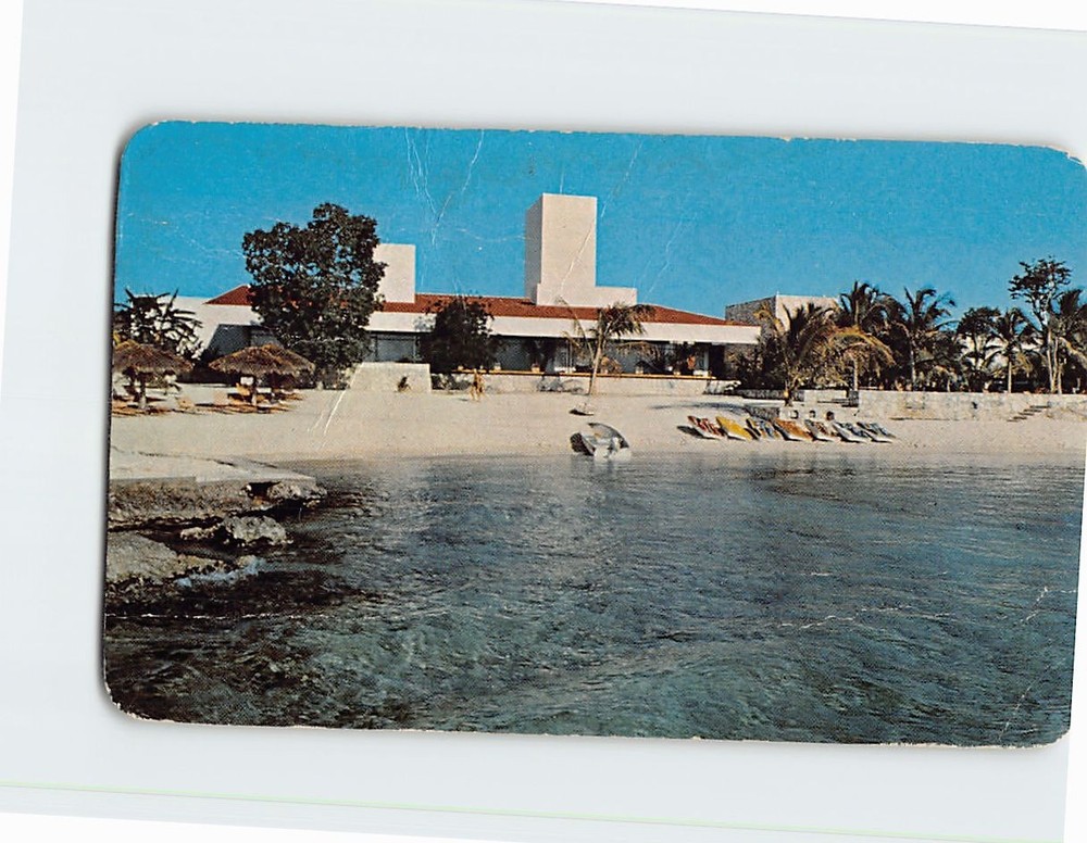 Postcard Beach and boat landing El Presidente Hotel Cozumel Mexico