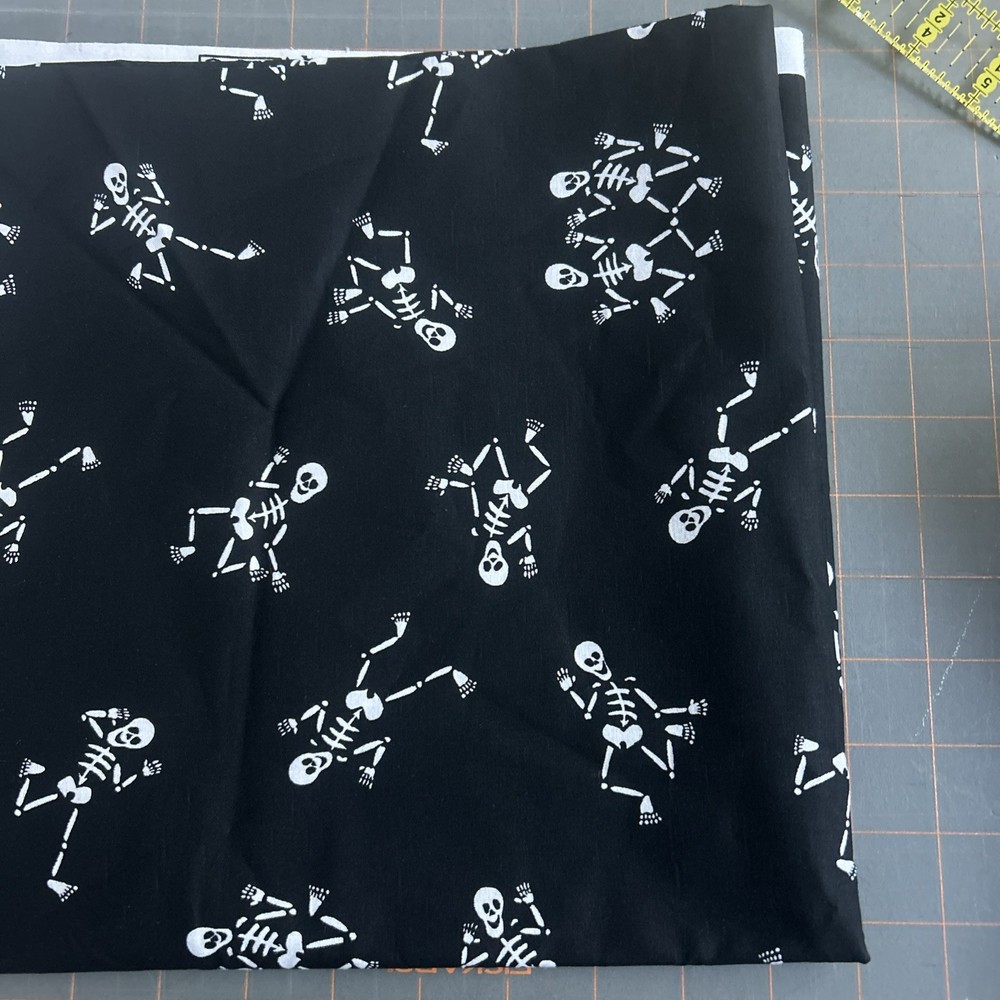 Cotton Halloween print fabric /white skeletons on black Half Yard Remnant
