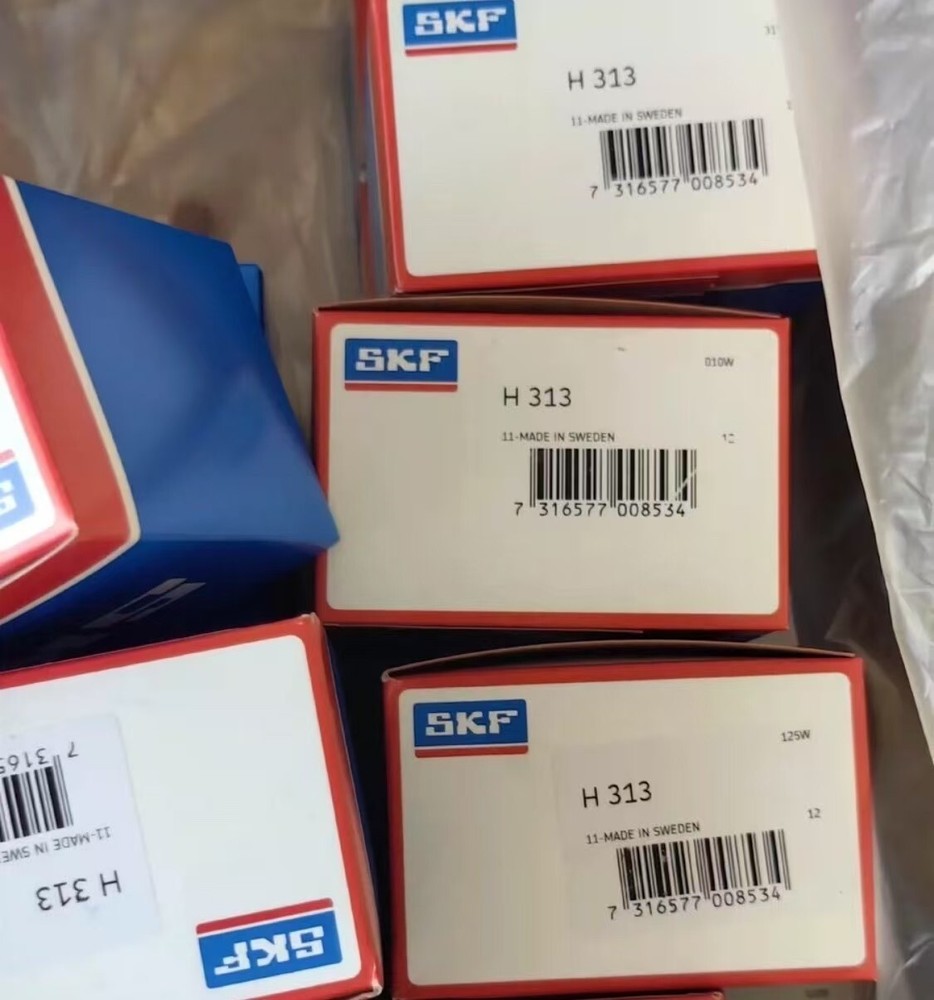 NEW SKF H 313 tightening sleeve assembly with locking nut and locking washer
