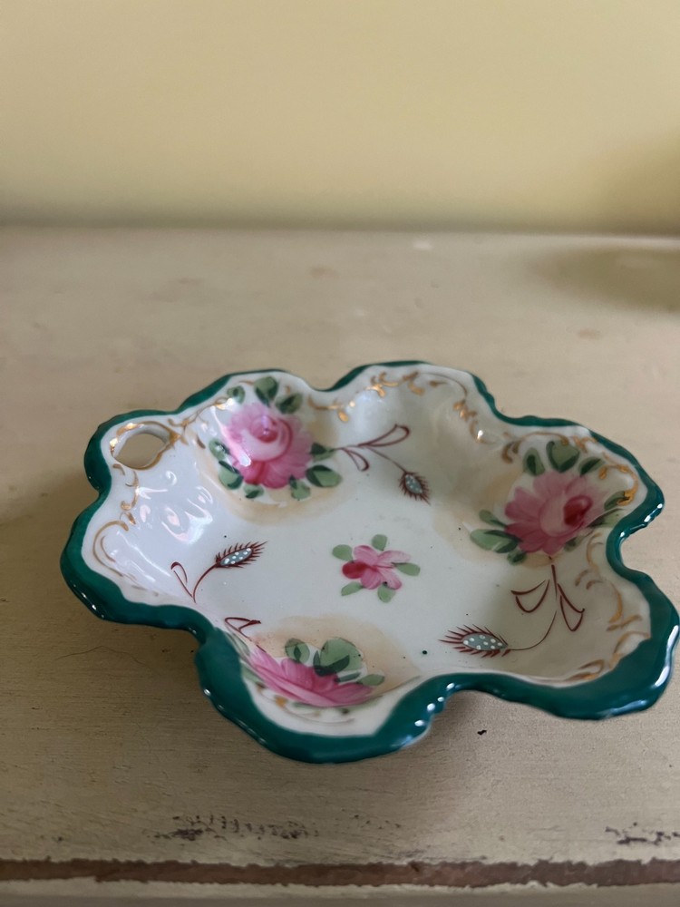 Hand painted porcelain trinket dish with rose floral pattern and green trim