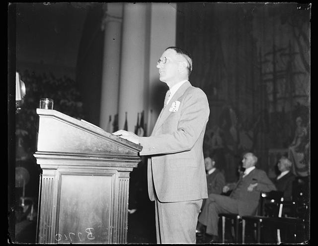 Photo:1940s Man Speaking at Podium Indoor Speech Press Conference