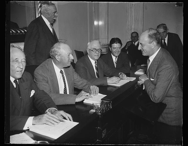 Jr., 2nd from right, Henry, Pat Harrison, 2nd from left; Robert M. La Follette