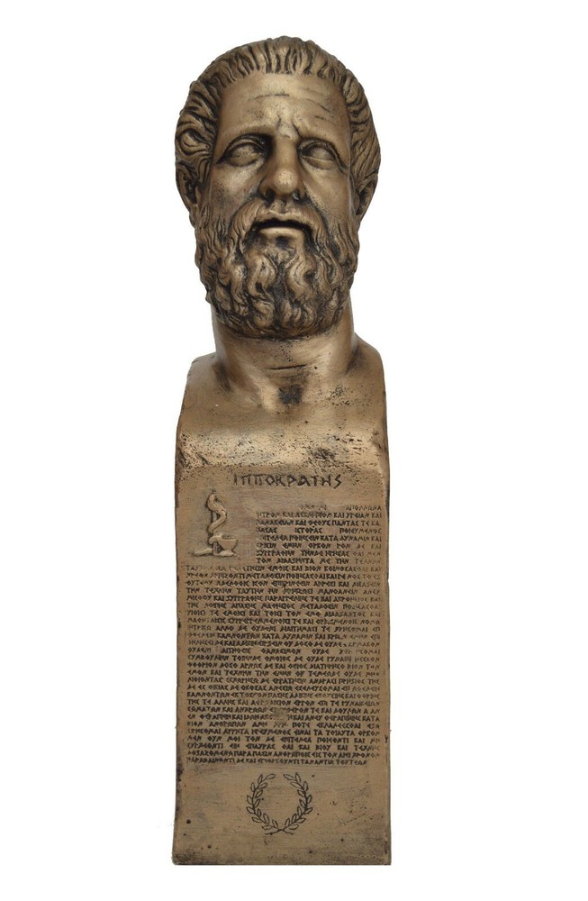Hippocrates the father of Western medicine statue with Hippocratic Oath in Greek