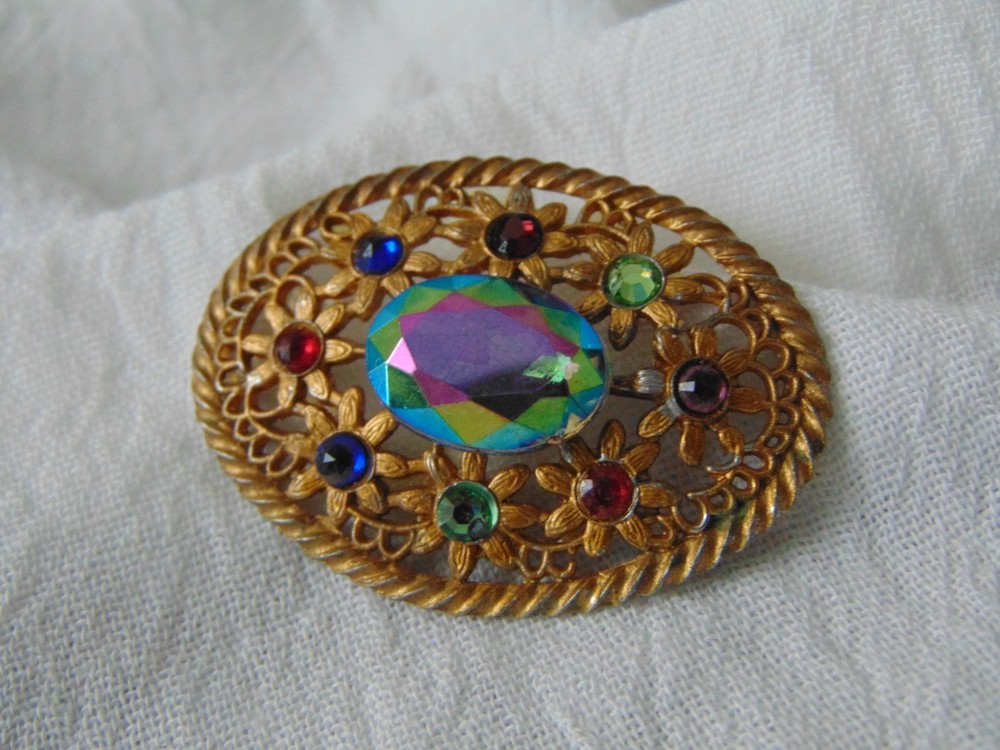 antique victorian sparkling crystals irridescent stone set into filigree brooch
