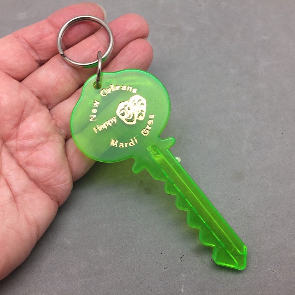 Vintage Happy Mardi Gras Keychain Green Key Plastic Glows in UV Parade Throw