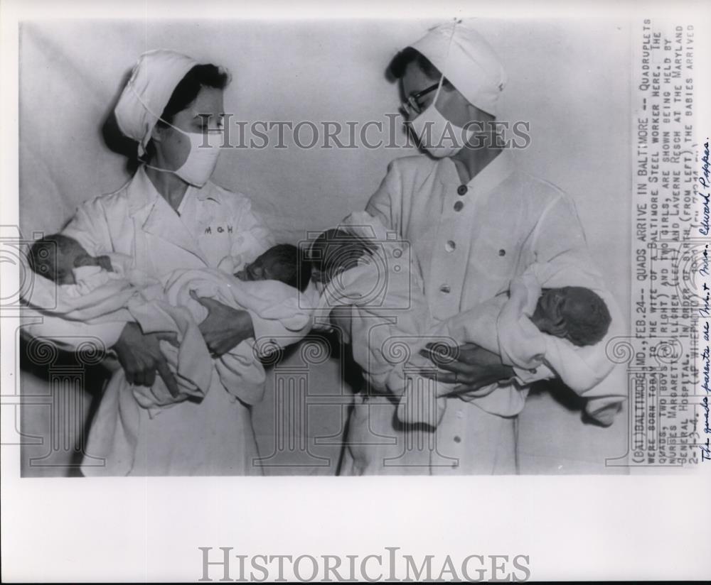 1951 Press Photo Mr & Mrs Edward Poppas' quadruplets held by nurses in Baltimore
