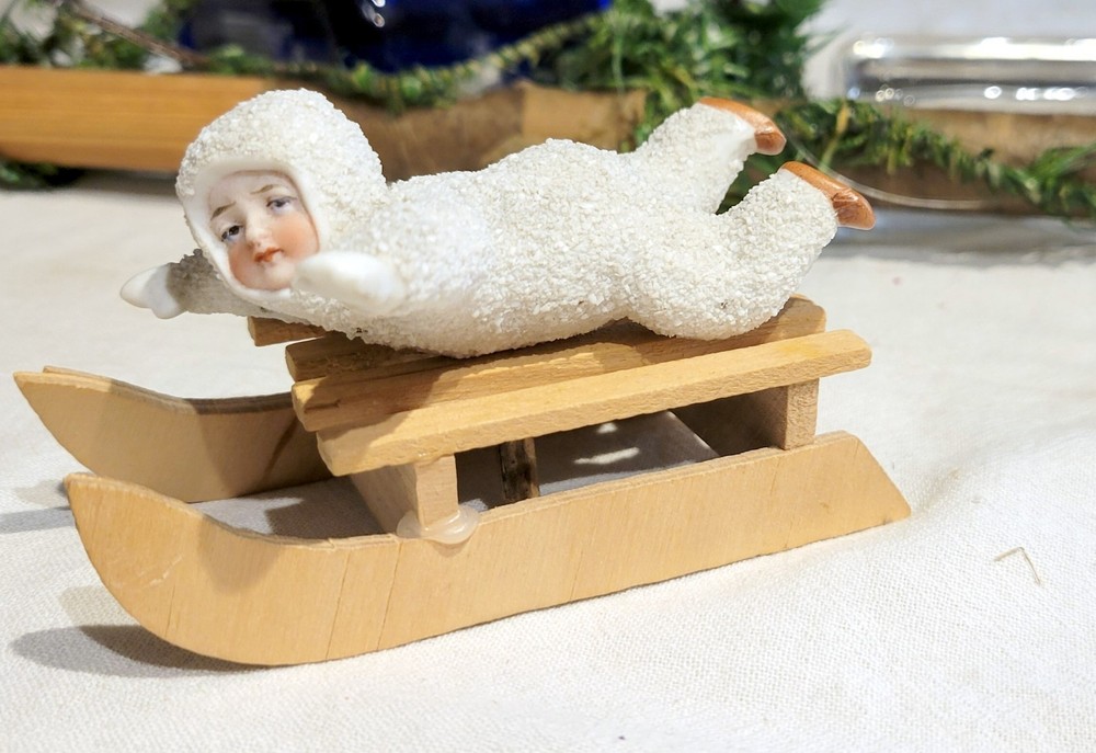 Hertwig  Snow Baby, on Wooden Sleigh. Early 1900s Miniature German Figure.
