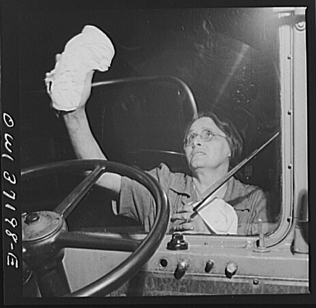 Pittsburgh, Pennsylvania. Cleaning the windshield of a bus at the Greyhound