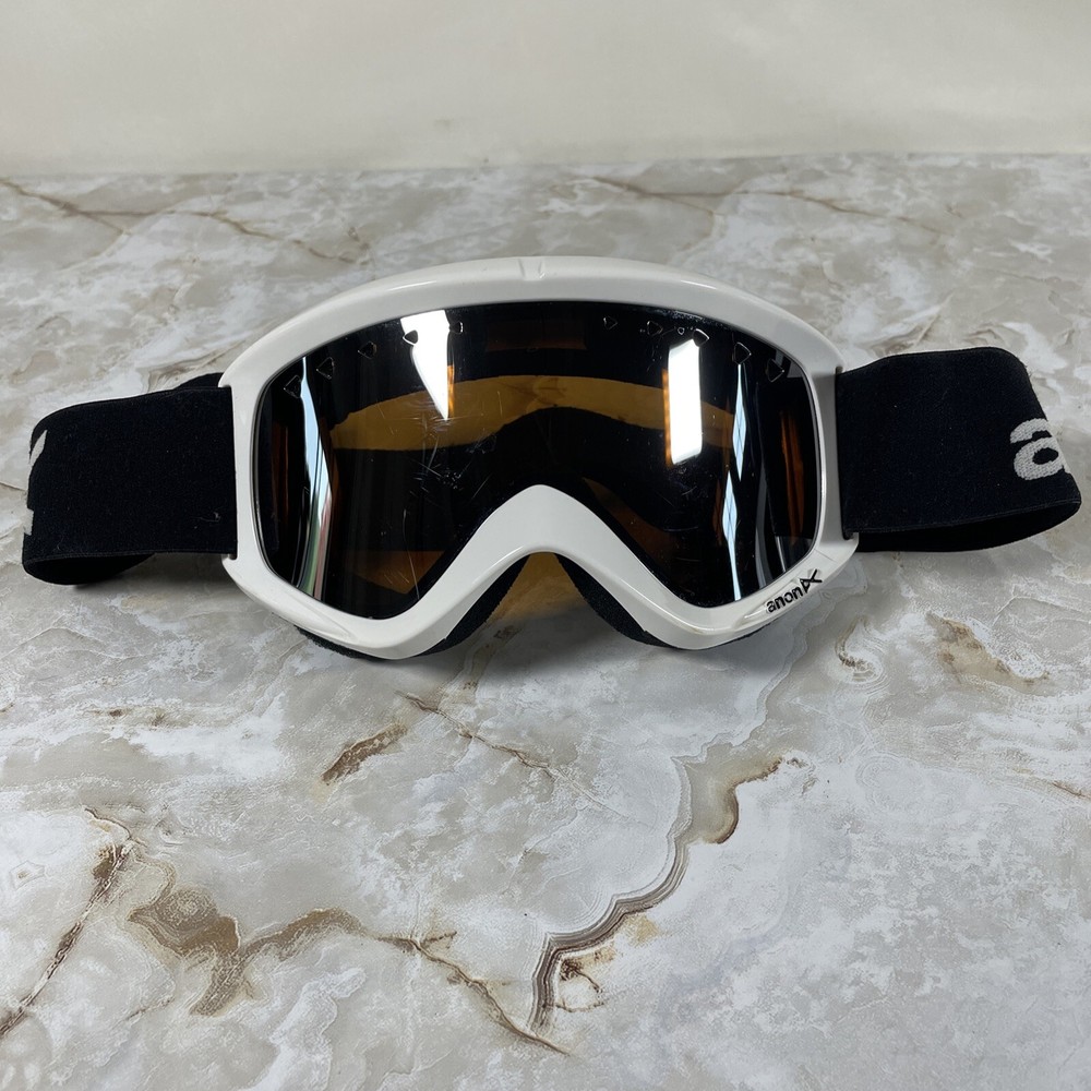 Anon Snow Goggles with Flexible White Frame, Black Strap, and Orange Lenses for Unisex Comfort and Style on the Slopes