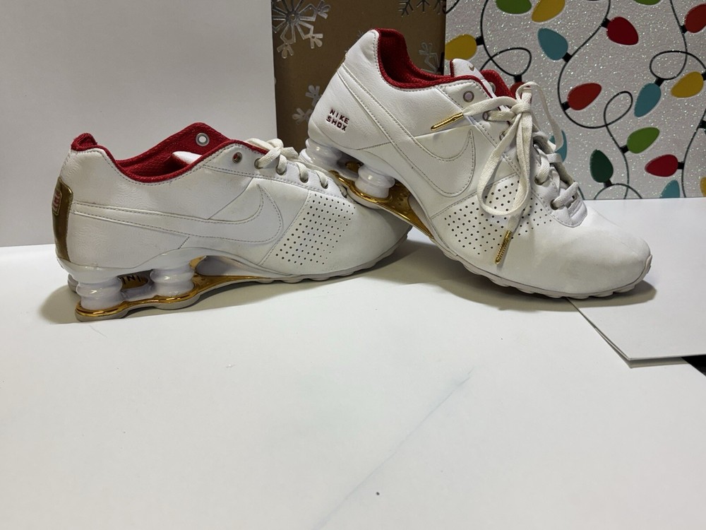 Red white and gold Nike shocks women’s size 7