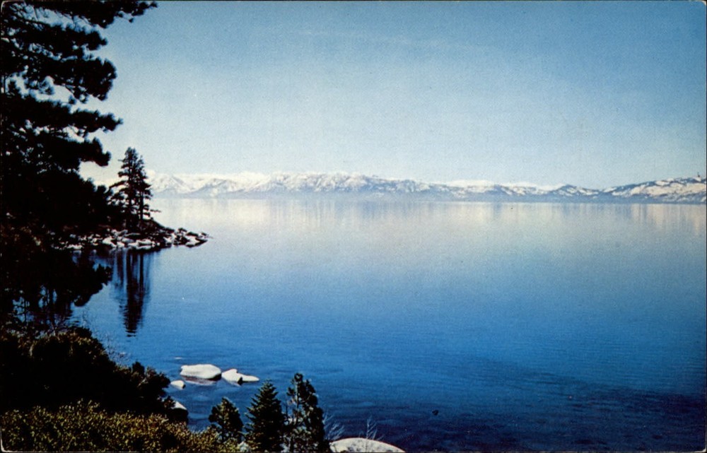 California Lake Tahoe in spring snow capped Sierras ~ 1970s postcard sku311