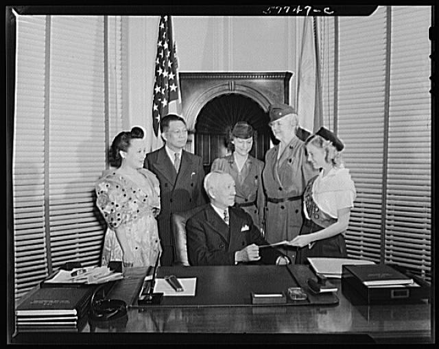 Photo:Office group portrait with military officer and woman 1930s 1940s