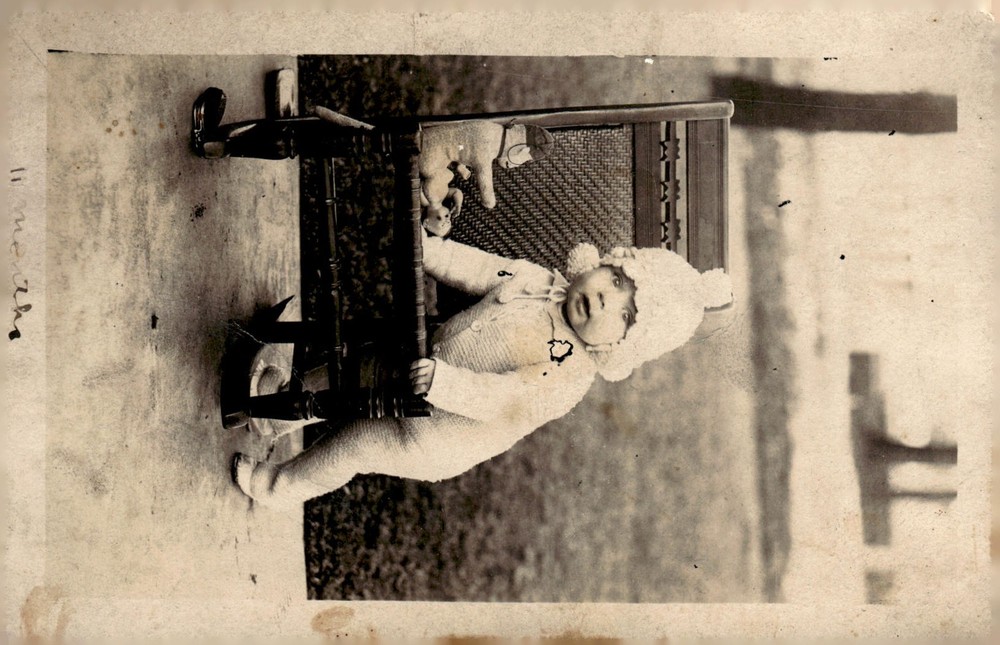 C1910s Antique Studio Portrait Baby in Knitted Outfit High Chair RPPC Postcard