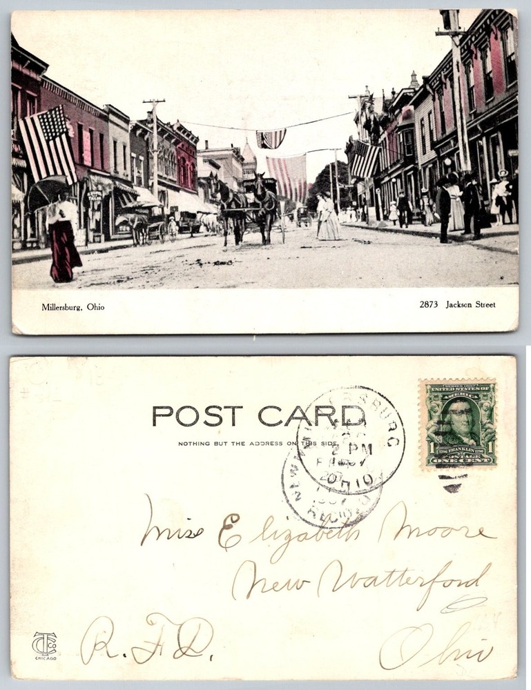 Millersburg OH Jackson Street 1910 Postcard Horse Carriages Flags Ohio RPPC