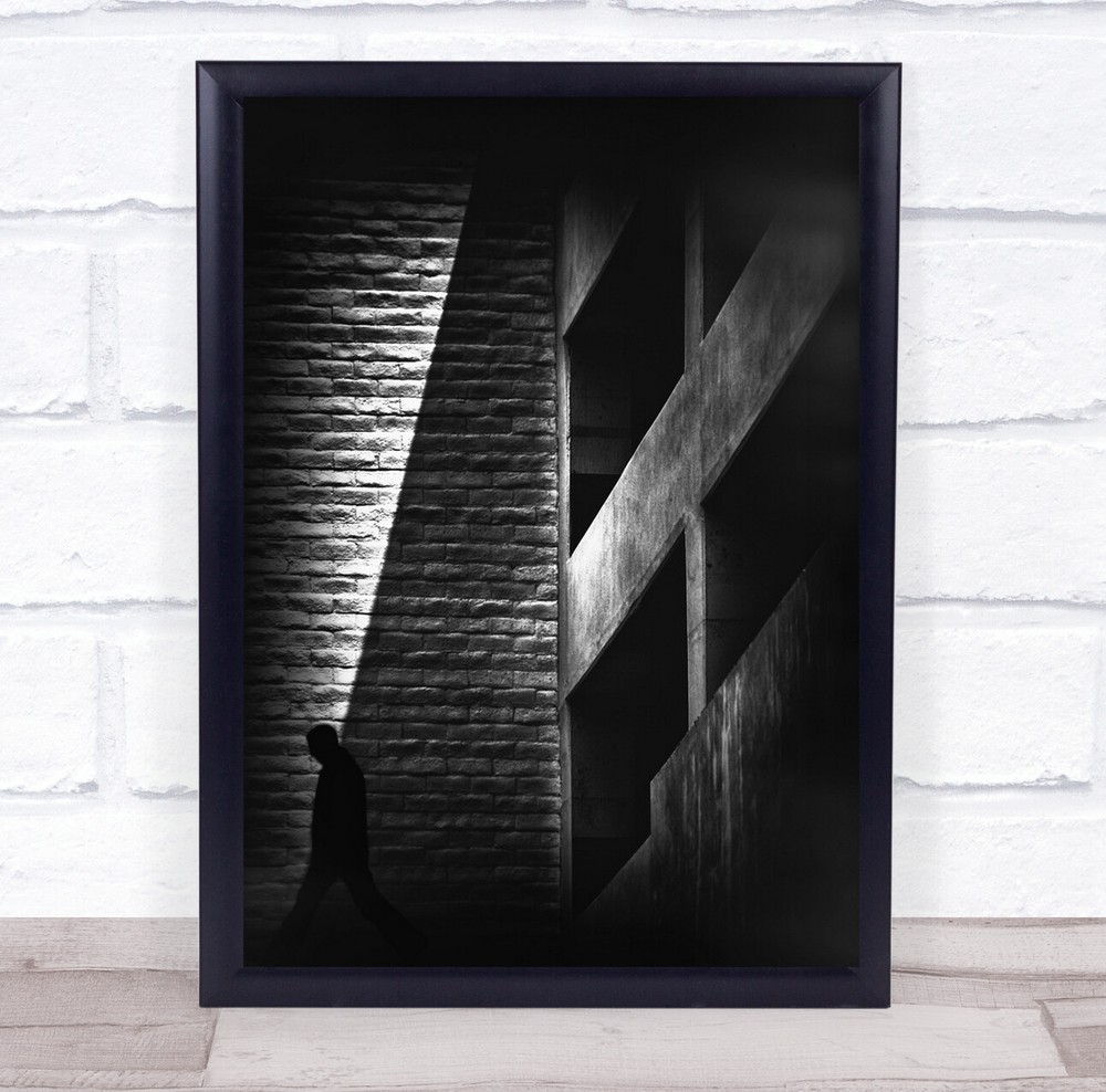 Shadows dark building wall person walk Wall Art Print