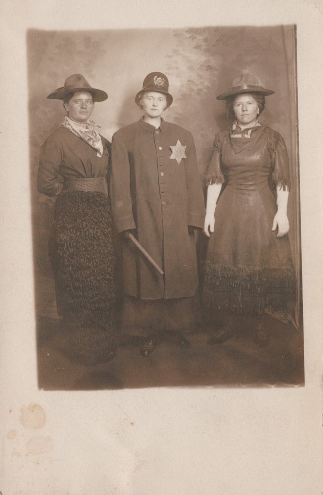 Woman dressed as Cop Novelty Studio photo postcard ~ Seattle WA Washington