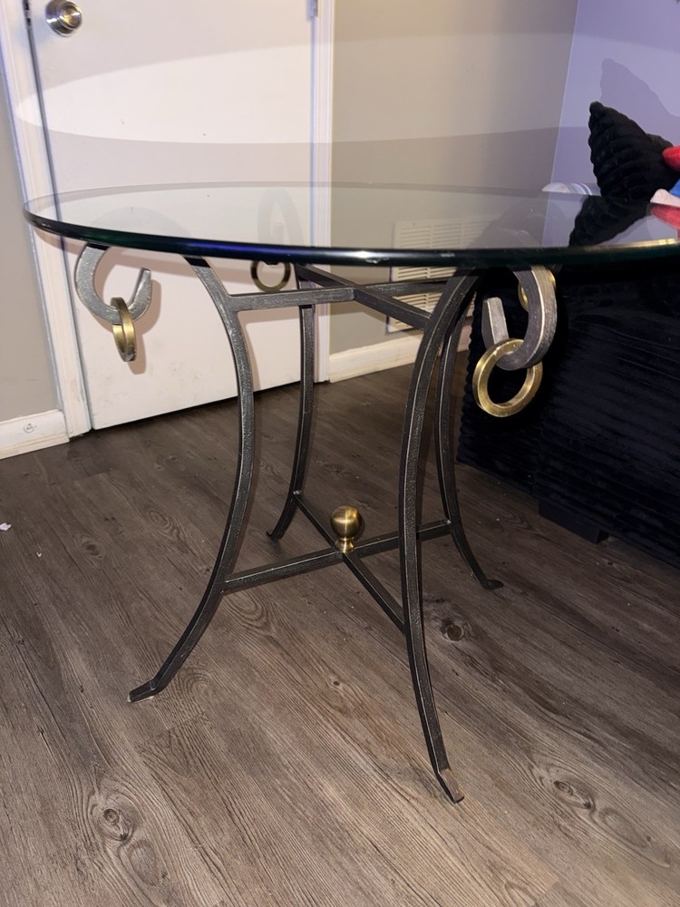 Round Glass Coffee Table with Metal Base and Gold Black Decorative Accents