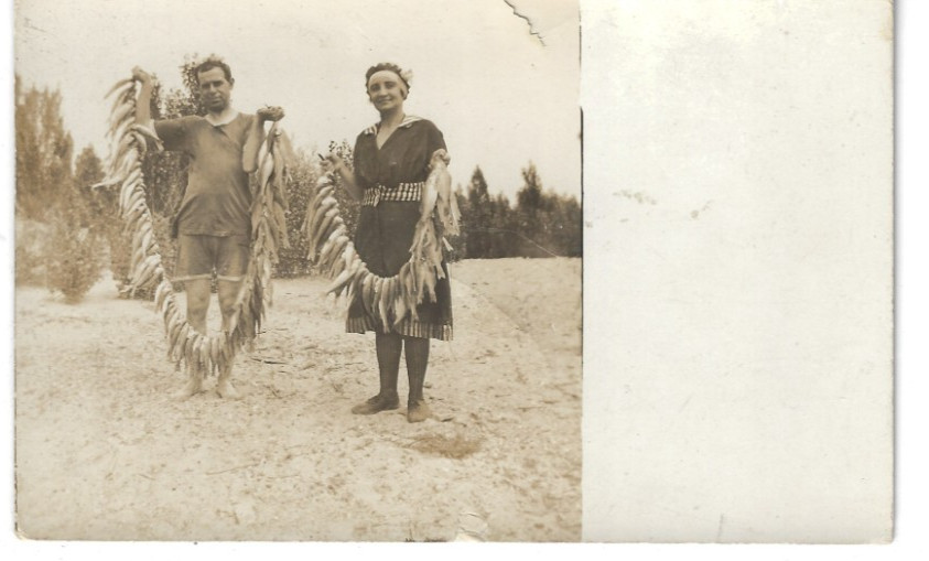 RPPC Man Women Holding String of Fish 1920s Swim Suit Hunting Fishing Real Photo