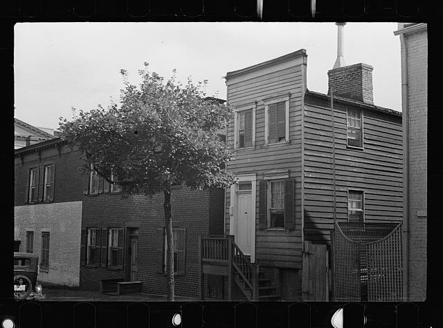 Photo:1940s Row Houses Residential Street Scene Tree Brick Wood Houses