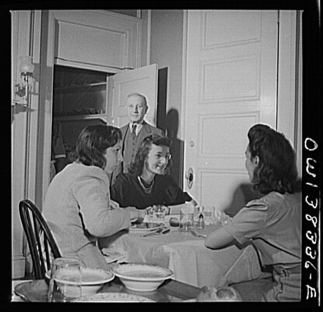 Washington, D.C. The proprieter of this boardinghouse watches the service at